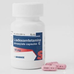 White prescription bottle with Lisdexamfetamine dimesylate capsules on a pharmacy counter